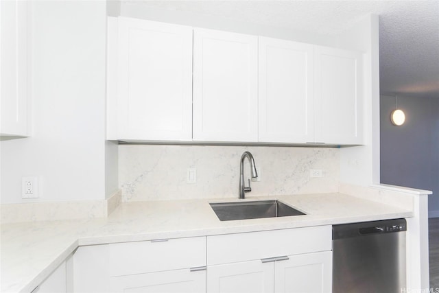 3161 Ala Ilima St Unit 403, Honolulu, HI 96818 - kitchen featuring backsplash, dishwasher, a sink, a textured ceiling, and white cabinetry