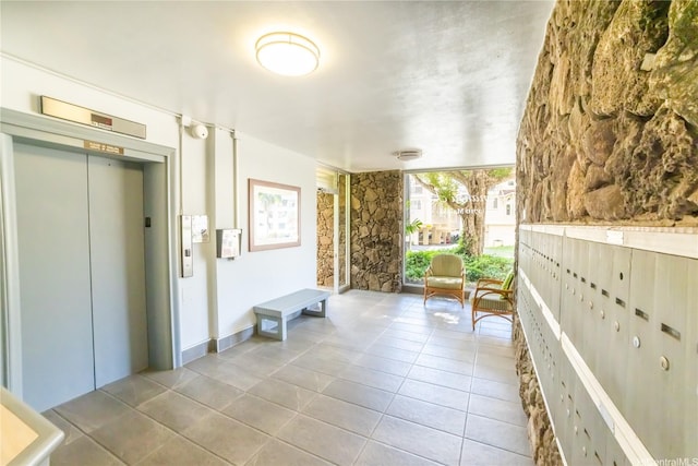 interior space featuring tile patterned floors and elevator