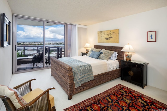 425 S St Unit 1401, Honolulu, HI 96813 - carpeted bedroom featuring floor to ceiling windows, access to exterior, and a textured ceiling