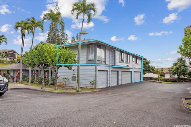 exterior space featuring an attached garage and driveway