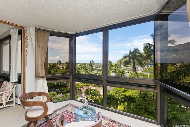 521 Hahaione St Unit 2-6J, Honolulu, HI 96825 - sunroom with carpet floors and a textured ceiling