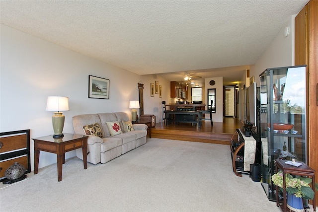 521 Hahaione St Unit 2-6J, Honolulu, HI 96825 - carpeted living area featuring a ceiling fan and a textured ceiling