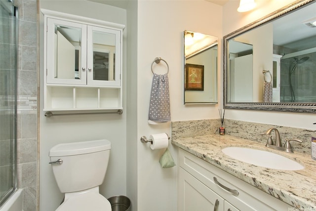 521 Hahaione St Unit 2-6J, Honolulu, HI 96825 - full bathroom featuring vanity, a shower with door, and toilet