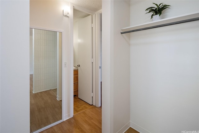 1524 Pensacola St Unit 217, Honolulu, HI 96822 - hall featuring wood finished floors and baseboards