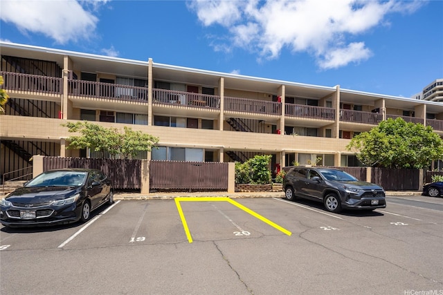 1524 Pensacola St Unit 217, Honolulu, HI 96822 - view of apartment building / complex featuring uncovered parking