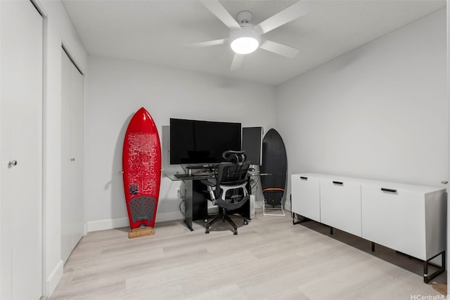office featuring a ceiling fan and light wood-type flooring