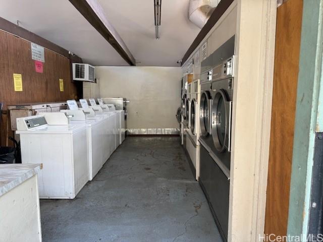 community laundry room featuring washing machine and dryer and visible vents