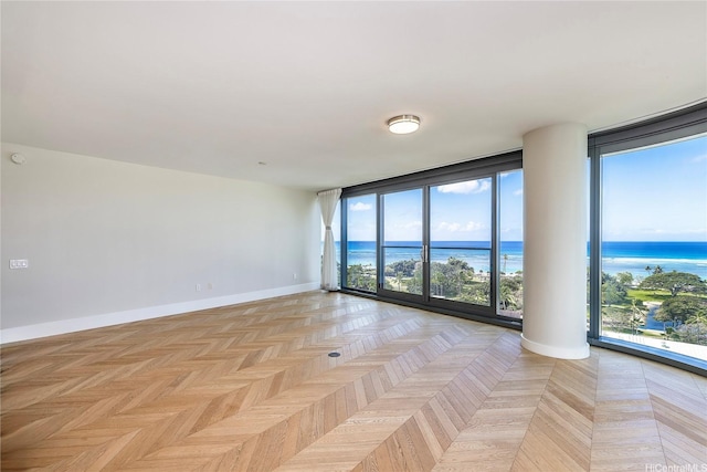 1108 Auahi St Unit 1001, Honolulu, HI 96814 - empty room with expansive windows, plenty of natural light, and a water view