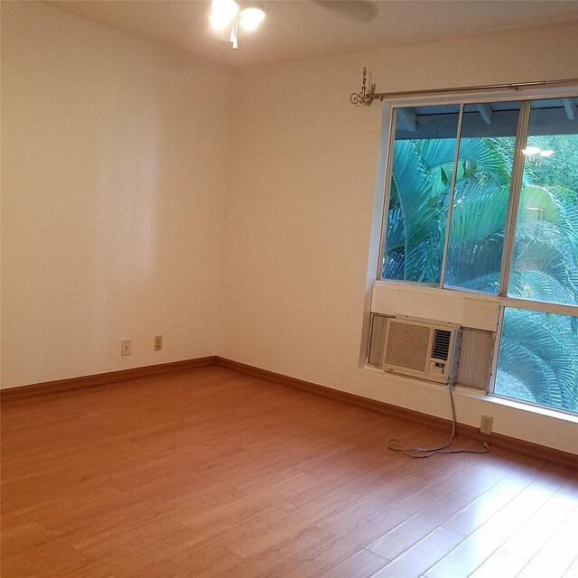 95-660 Wikao St Unit K206, Mililani, HI 96789 - spare room featuring a wealth of natural light, wood finished floors, and baseboards