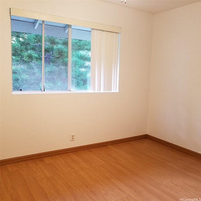 95-660 Wikao St Unit K206, Mililani, HI 96789 - spare room featuring wood finished floors and baseboards