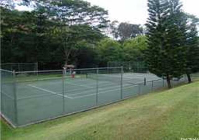 95-660 Wikao St Unit K206, Mililani, HI 96789 - view of tennis court with a lawn and fence