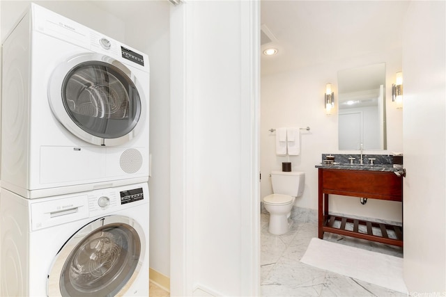 223 Saratoga Rd Unit 3703, Honolulu, HI 96815 - laundry area with marble finish floor, baseboards, stacked washer / drying machine, and laundry area