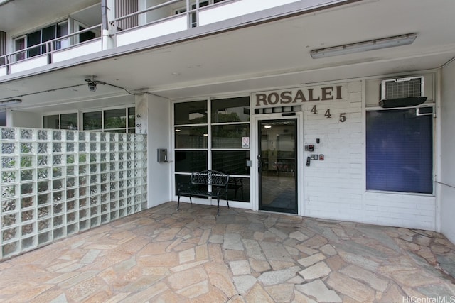 445 Kaiolu St Unit 211, Honolulu, HI 96815 - view of patio / terrace with a balcony and a wall mounted air conditioner