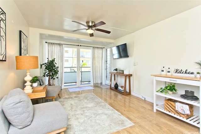 445 Kaiolu St Unit 211, Honolulu, HI 96815 - living room featuring wood finished floors, ceiling fan, and baseboards