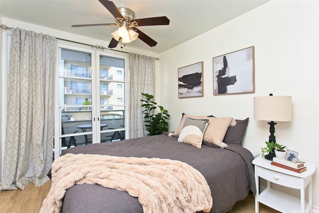 445 Kaiolu St Unit 211, Honolulu, HI 96815 - bedroom featuring wood finished floors and a ceiling fan