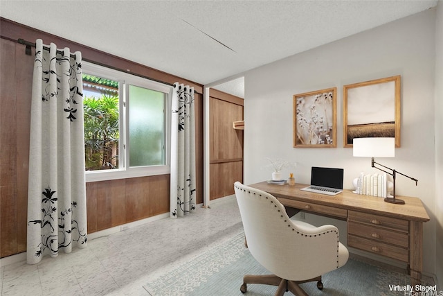 office featuring tile patterned floors and baseboards