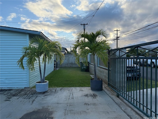 view of yard featuring a patio area and a fenced backyard