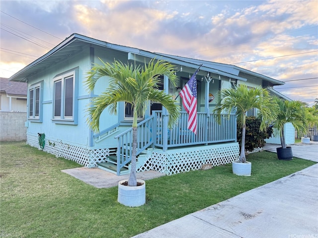 view of front of home with a front lawn and covered porch