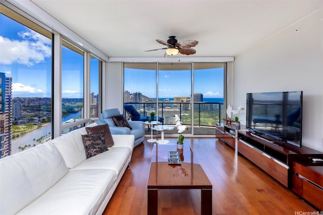 1837 Kalakaua Ave Unit 3304, Honolulu, HI 96815 - living area featuring floor to ceiling windows, wood finished floors, and ceiling fan
