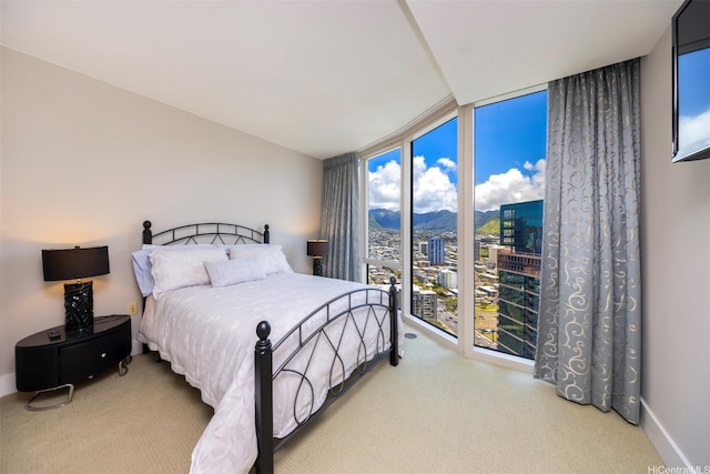 1837 Kalakaua Ave Unit 3304, Honolulu, HI 96815 - bedroom with floor to ceiling windows, carpet floors, a city view, and baseboards