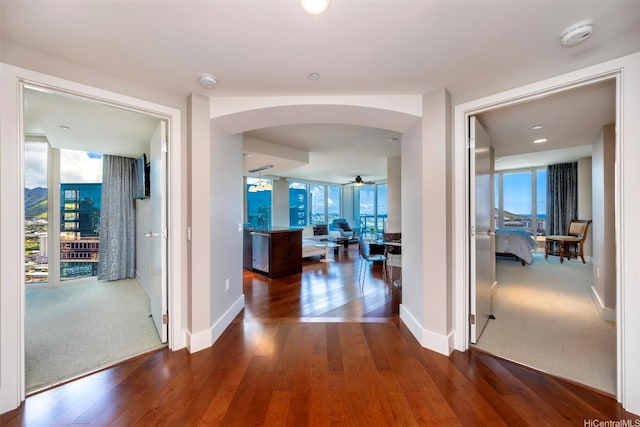 1837 Kalakaua Ave Unit 3304, Honolulu, HI 96815 - hall with arched walkways, baseboards, healthy amount of natural light, and wood finished floors