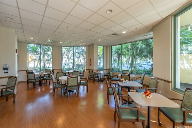 dining area with wood finished floors, visible vents, and a wealth of natural light