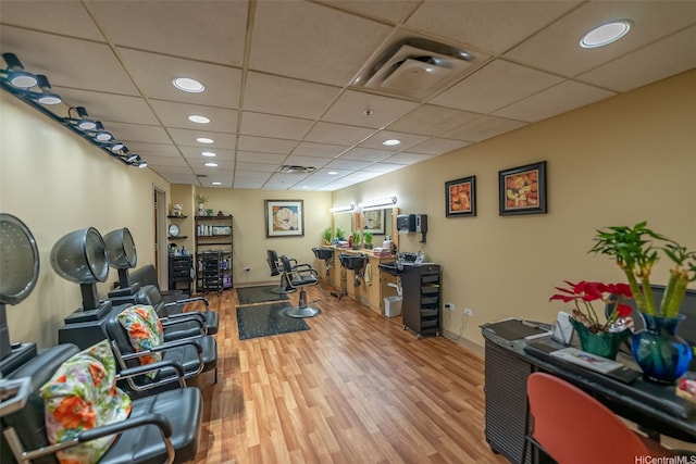 office with visible vents, wood finished floors, a drop ceiling, and recessed lighting