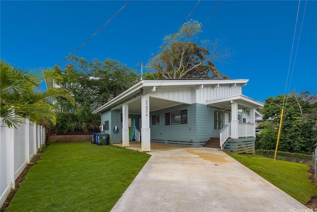 45-842 Anoi Rd Unit E, Kaneohe, HI 96744 - view of front facade featuring covered porch, concrete driveway, and an attached carport