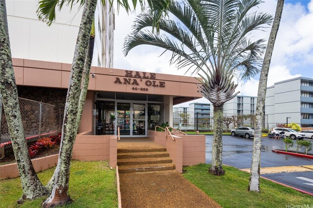 46-255 Kahuhipa St Unit A1204, Kaneohe, HI 96744 - view of building exterior with uncovered parking