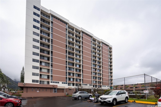 46-255 Kahuhipa St Unit A1204, Kaneohe, HI 96744 - view of property with fence and uncovered parking