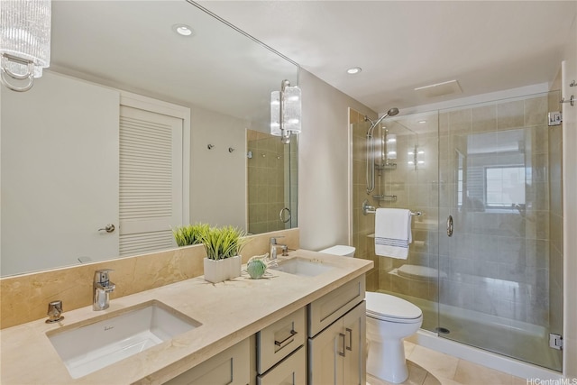 full bathroom with a sink, a shower stall, and toilet