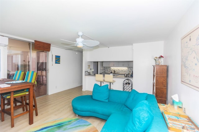 2600 Pualani Way Unit 1201, Honolulu, HI 96815 - living room with ceiling fan and light wood-style flooring