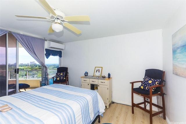 2600 Pualani Way Unit 1201, Honolulu, HI 96815 - bedroom with a wall mounted air conditioner, ceiling fan, baseboards, and light wood-type flooring