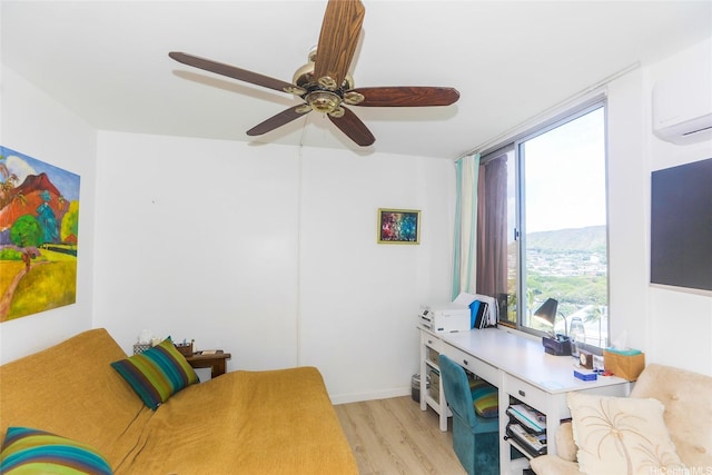 2600 Pualani Way Unit 1201, Honolulu, HI 96815 - office with a ceiling fan, light wood-style floors, and a wall mounted air conditioner