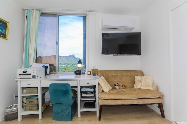 2600 Pualani Way Unit 1201, Honolulu, HI 96815 - home office featuring an AC wall unit, light wood-style flooring, and plenty of natural light