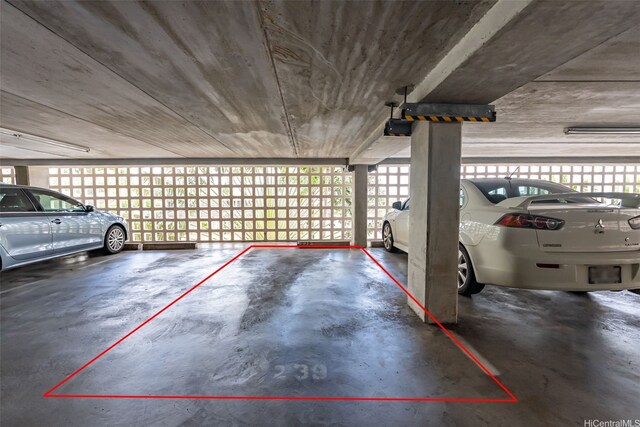 parking garage featuring a garage door opener