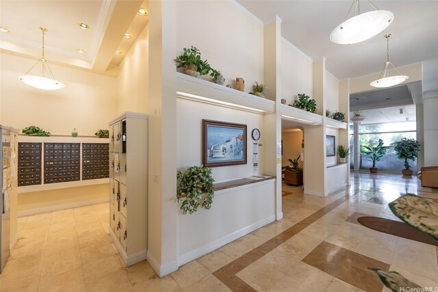 hall with recessed lighting, a high ceiling, mail area, and baseboards