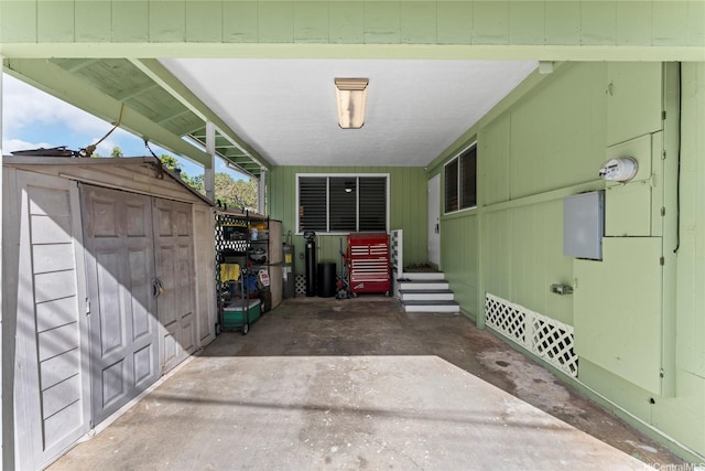 45-533 Pahia Rd, Kaneohe, HI 96744 - view of patio with a storage unit and an outbuilding