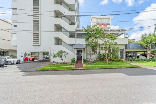 1615 Wilder Ave Unit 604, Honolulu, HI 96822 - view of building exterior featuring parking