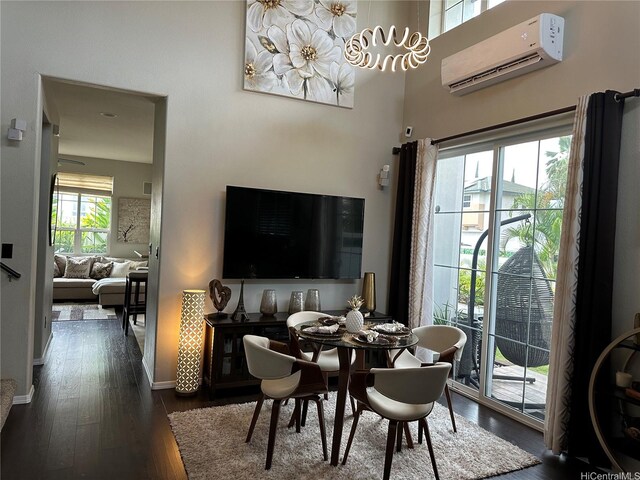 91-1005 Maulihiwa St, Kapolei, HI 96707 - dining area featuring an AC wall unit, dark wood finished floors, and baseboards