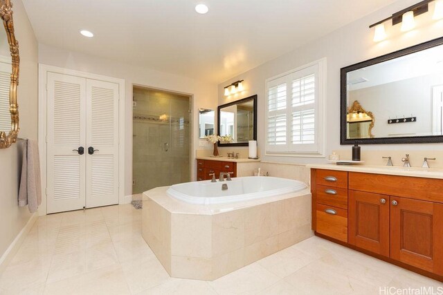 91-1068 Kaikohola St, Ewa Beach, HI 96706 - full bathroom with a garden tub, vanity, a shower stall, and a closet