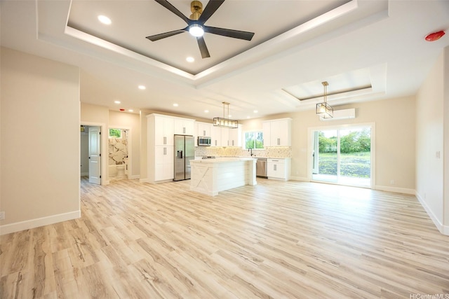 15-1692 7th Ave, Keaau, HI 96749 - kitchen with a raised ceiling, appliances with stainless steel finishes, open floor plan, recessed lighting, and a kitchen island