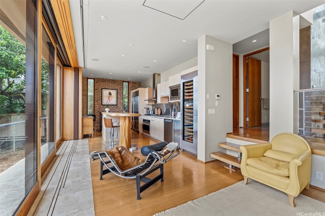 61-279 Kamehameha Hwy, Haleiwa, HI 96712 - living area featuring light wood-style floors, recessed lighting, and brick wall