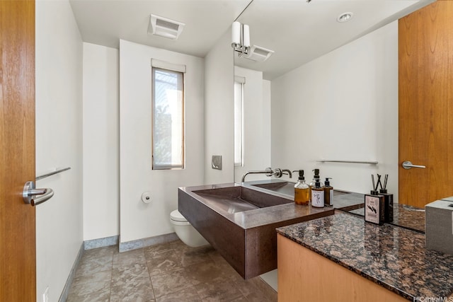 61-279 Kamehameha Hwy, Haleiwa, HI 96712 - bathroom with toilet, baseboards, and vanity
