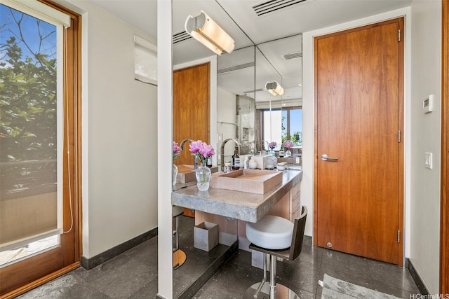 61-279 Kamehameha Hwy, Haleiwa, HI 96712 - bathroom featuring a sink, baseboards, and granite tiled floors