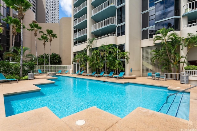 1212 Nuuanu Ave Unit 2406, Honolulu, HI 96817 - community pool featuring a patio and fence