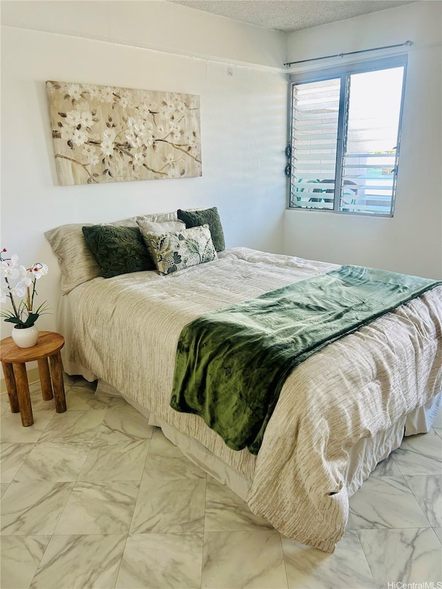837 Kapahulu Ave Unit 302, Honolulu, HI 96816 - bedroom with marble look tile flooring and a textured ceiling