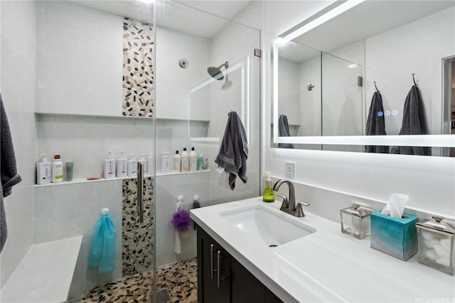 bathroom with vanity and a stall shower