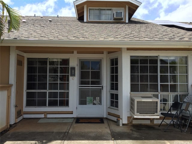 432 Mananai Pl Unit 18C, Honolulu, HI 96818 - rear view of property with cooling unit, a patio area, and roof with shingles