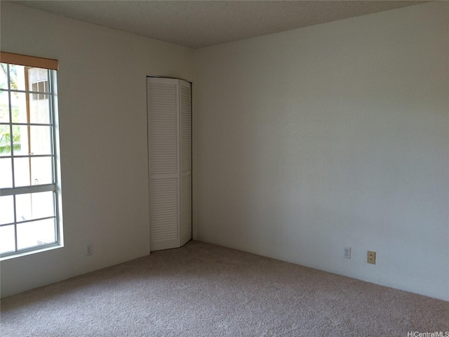 432 Mananai Pl Unit 18C, Honolulu, HI 96818 - carpeted spare room featuring a healthy amount of sunlight